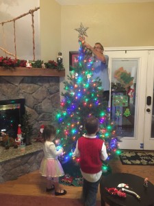 NCCF Founder, Gary Nice decorating the Christmas Tree with his family.