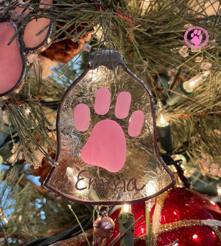 Pink paw ornament in christmas tree